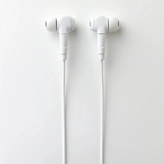 A pair of white wired earphones is neatly arranged side by side on a plain white background, with the wires hanging straight down.