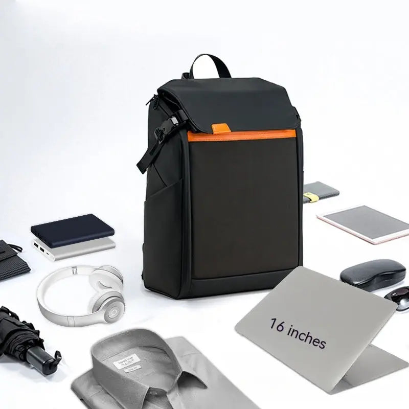The Dropshipman Bluetooth Projection Backpack is water resistant and shown with a 16-inch laptop, headphones, folded shirt, umbrella, mouse, portable hard drive, and notebook.