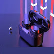 FLIPSTYLEZLLC’s Subwoofer Class 7 Waterproof True Wireless Earbuds In-Ear TWS Bluetooth Headphones rest in an open charging case on a reflective blue and purple surface, with a metallic sphere and abstract multicolored columns nearby.