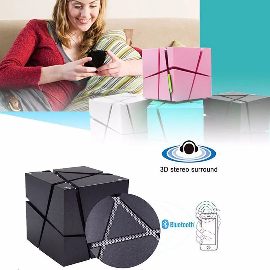 A woman sits on a couch holding a phone, with Dropshipman's CubeSync Rubik Cube Bluetooth Speakers below, showcasing portable Bluetooth connectivity and 3D stereo surround sound.