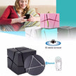 A woman sits on a couch holding a phone, with Dropshipman's CubeSync Rubik Cube Bluetooth Speakers below, showcasing portable Bluetooth connectivity and 3D stereo surround sound.