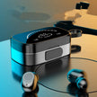 A close-up of the FLIPSTYLEZLLC Wireless Bluetooth Earphones for Samsung, Huawei, and Xiaomi shows the black and silver TWS charging case with digital display and matching earbuds on a reflective surface, set against blurred abstract lighting.