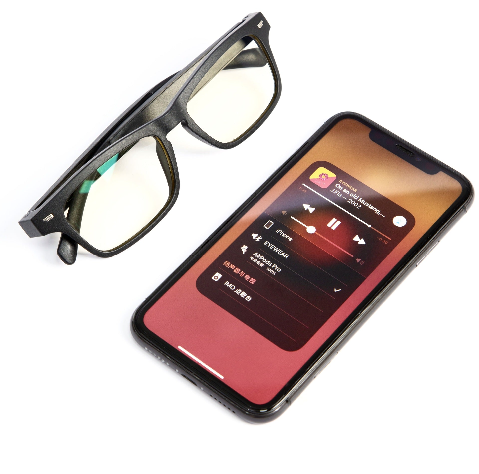 A pair of Dropshipman Smart Sunglass Headphones rests beside a smartphone showing a music player screen with album art, song details, and playback controls.