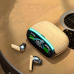 A pair of Dropshipman Wood Grain Wireless Bluetooth Earbuds with a wooden charging case featuring a digital display rests on an acoustic guitar. The case reads 