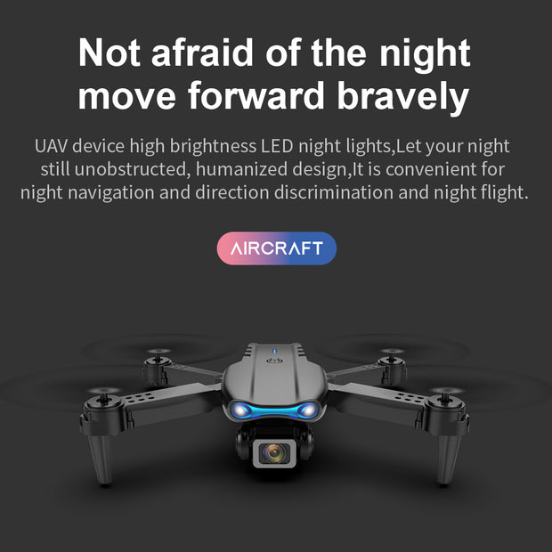 A black Dropshipman K3pro Drone E99 Folding with LED lights is shown on a dark background. Text above reads, "Not afraid of the night, move forward bravely," highlighting night flying and aerial photography.