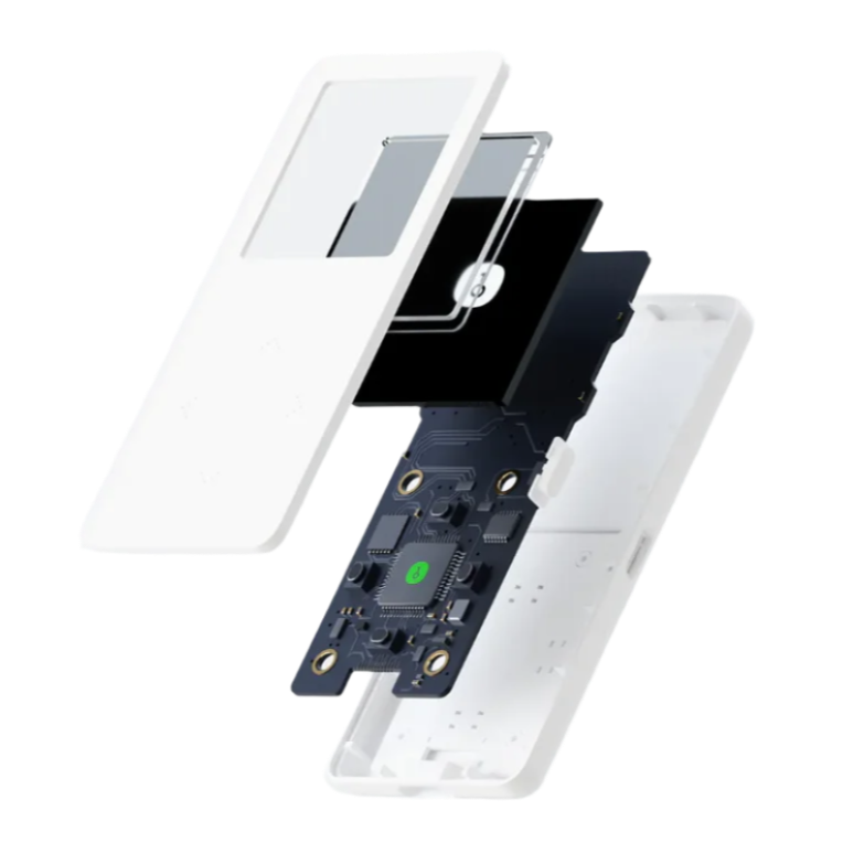 An exploded view of the HeadphoneHeat OneKey Mini Offline Crypto Wallet, showcasing its internal components. Visible parts include a white outer casing, a small display screen, a black circuit board with electronic elements, and additional internal layers that fit into the outer shell. All parts are floating apart in alignment.