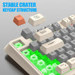 A K82 Mechanical Gaming Keyboard by HeadphoneHeat, featuring removed keys to reveal its green backlit switches. The image emphasizes the 