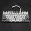 The DEBROGLIE LT78 Split Creative Mechanical Keyboard by HeadphoneHeat sits against a black background, showcasing its grey and white keycaps connected by a coiled cable. It features Kailh switches and an ergonomic design for efficient typing.