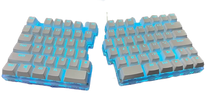 The DEBROGLIE LT78 Split Creative Mechanical Keyboard by HeadphoneHeat features an ergonomic split design with a glowing blue backlight. It includes grey keycaps with white lettering, Kailh switches, and two separate halves, each with letters, numbers, and function keys.