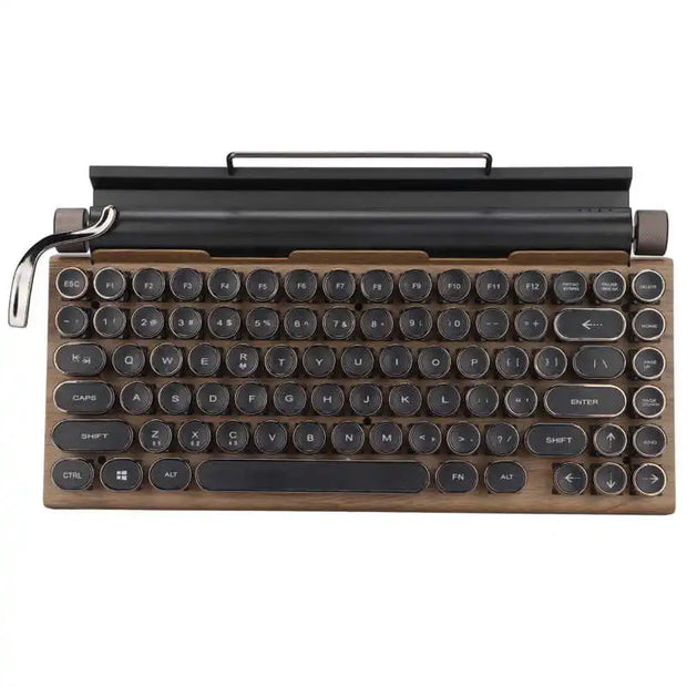 The Retro Typewriter Mechanical Keyboard by HeadphoneHeat features round black keys, a dark brown casing, and a silver side handle for a typewriter look. It supports Bluetooth 5.0 and includes an integrated holder for tablets or phones at the back.