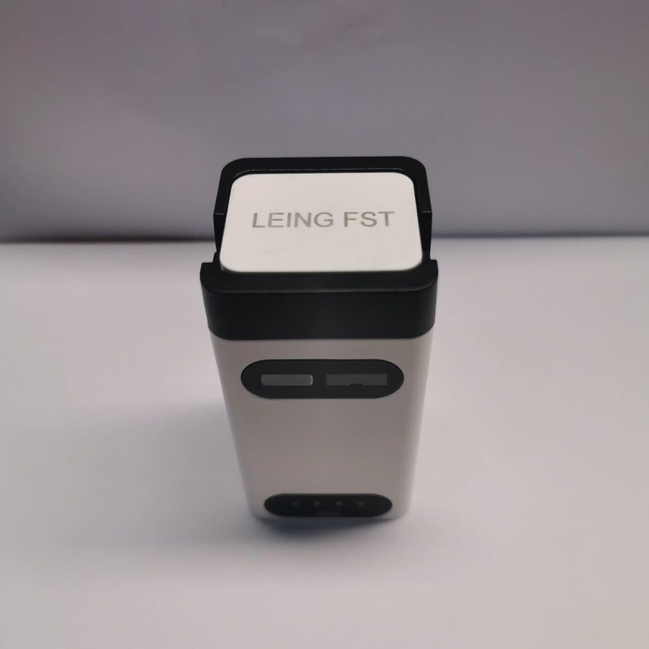 A rectangular Dropshipman Bluetooth Virtual Laser Keyboard with a white top labeled "LEING FST" and a black border, featuring two front buttons, is shown against a plain white background.
