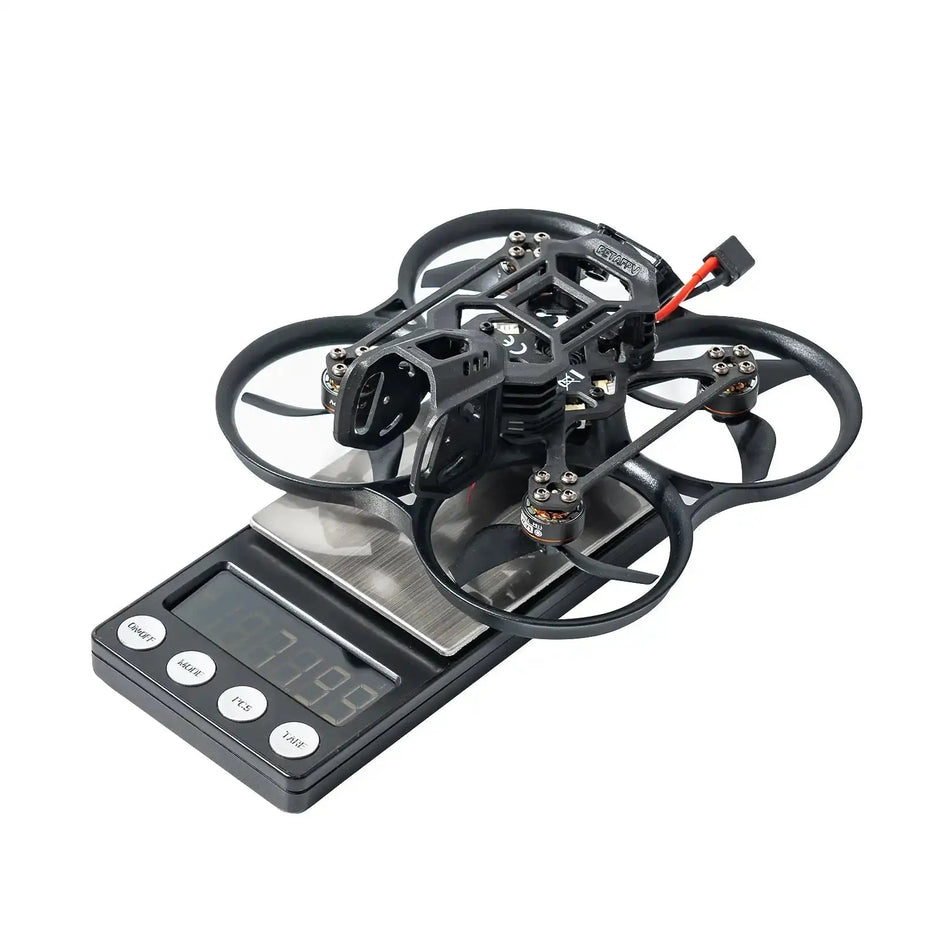 A BETAFPV Pavo20 Pro II Brushless Whoop Quadcopter for DJI O4/O4 Pro by HeadphoneHeat, featuring propeller guards, rests on a digital scale showing its weight; the lightweight drone is pictured without propellers or extra parts.