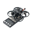 A BETAFPV Pavo20 Pro II Brushless Whoop Quadcopter for DJI O4/O4 Pro by HeadphoneHeat, featuring propeller guards, rests on a digital scale showing its weight; the lightweight drone is pictured without propellers or extra parts.