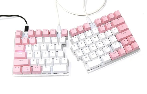 The DEBROGLIE LT78 Split Creative Mechanical Keyboard by HeadphoneHeat has an ergonomic design with pink and white keycaps. Each half, connected via USB cable, features Kailh switches for letters and functions, offering a compact yet comfortable typing experience.