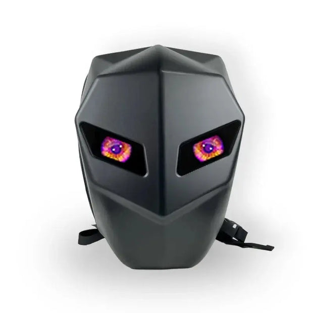 The HeadphoneHeat Night Shadow Knight Backpack is a black, angular travel backpack with a robotic helmet look, featuring colorful glowing eye shapes on the front. Its unique unisex design stands out brilliantly against a plain white background.