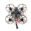 The HeadphoneHeat HappyModel Mobula6 2024 1S 65mm Ultra Light Micro FPV Drone2, featuring ELRS 2.4GHz technology and a SuperX Flight Controller, reveals its sleek design from above with an exposed electronic circuit board against a plain background.