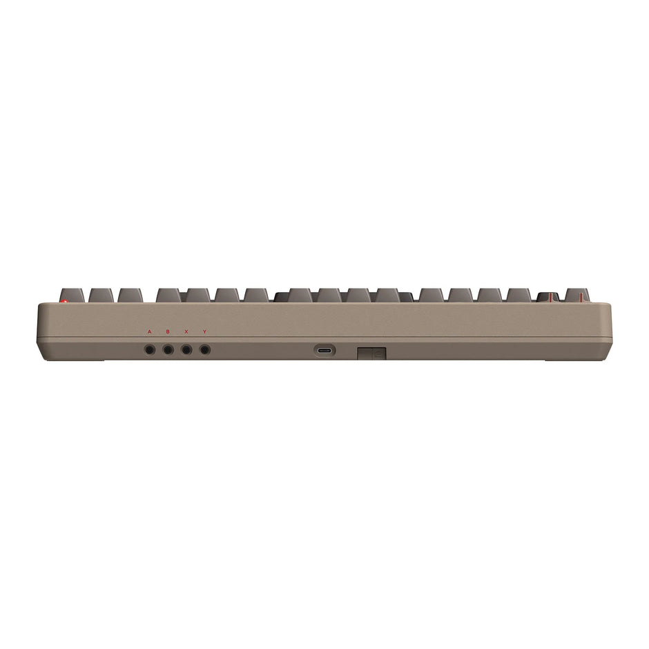 Side view of the 8BitDo Retro Mechanical Keyboard by HeadphoneHeat, showcasing its compact and minimalist design. It features a USB-C port, power switch, and LED indicators, with keys that are slightly elevated to highlight its slim profile reminiscent of classic 8Bitdo aesthetics.