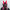 The wearer sports a HeadphoneHeat LED Lights Cyberpunk Full Face Mask, featuring pink-accented rabbit ear-shaped protrusions and a glossy black visor. Set against a white backdrop in full black attire, this helmet seamlessly combines sci-fi and anime elements for an exceptional cyberpunk vibe.