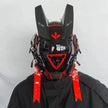 A person in black attire wears a futuristic HeadphoneHeat LED Lights Cyberpunk Full Face Mask. It features red and black accents, angular antenna-like extensions, a reflective visor, intricate side details, and LED lights on top for a sleek robotic look.