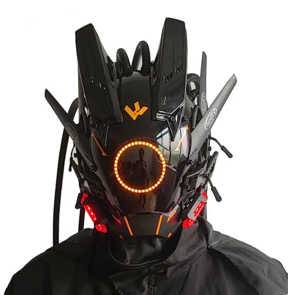 The person wears a HeadphoneHeat LED Lights Cyberpunk Full Face Mask, featuring a futuristic black design with angular features and vibrant orange-red LED lights. Protrusions accentuate its sci-fi style around an illuminated circular light.
