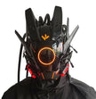 The person wears a HeadphoneHeat LED Lights Cyberpunk Full Face Mask, featuring a futuristic black design with angular features and vibrant orange-red LED lights. Protrusions accentuate its sci-fi style around an illuminated circular light.