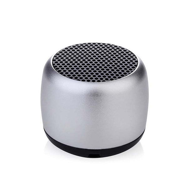 The Portable Mini Bluetooth Speaker by HeadphoneHeat.Com is a small, silver, cylindrical device with black mesh ends that delivers high-quality sound and is set against a white background.
