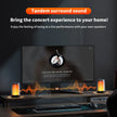 A modern home computer setup showcases a widescreen monitor with a music player interface. Two chic QERE Bluetooth Speakers by HeadphoneHeat emit orange soundwave visuals from the desk. Text above reads: 