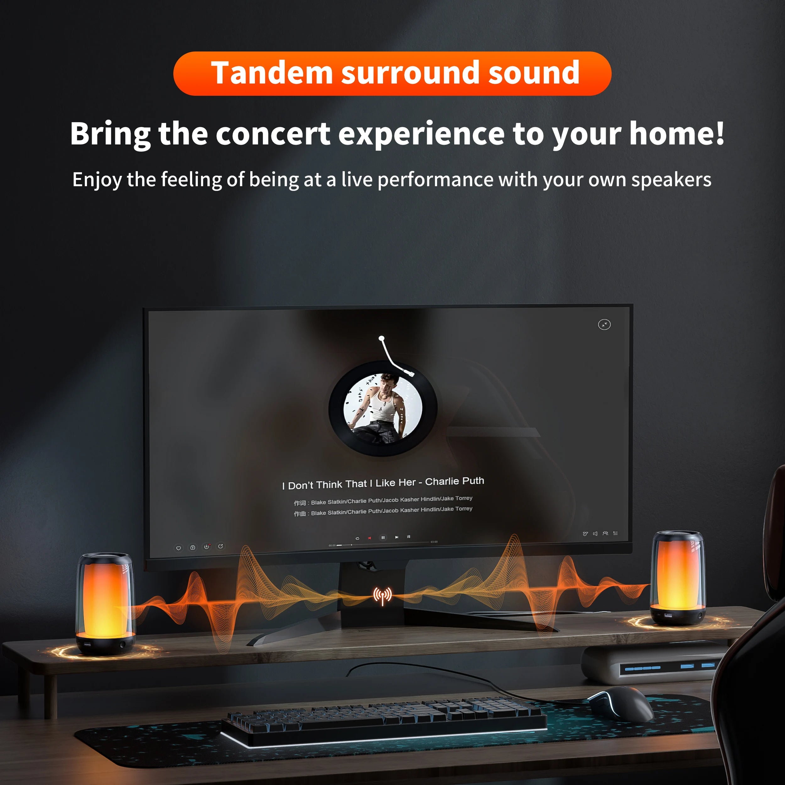 A modern home computer setup showcases a widescreen monitor with a music player interface. Two chic QERE Bluetooth Speakers by HeadphoneHeat emit orange soundwave visuals from the desk. Text above reads: 
