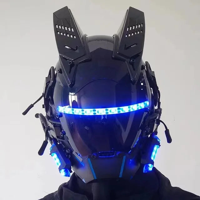 The LED Lights Cyberpunk Full Face Mask by HeadphoneHeat is a futuristic black helmet with angular features, blue LED strips across the visor and sides, multiple antennas and panels, offering a high-tech robotic style that's perfect for someone in dark clothing.
