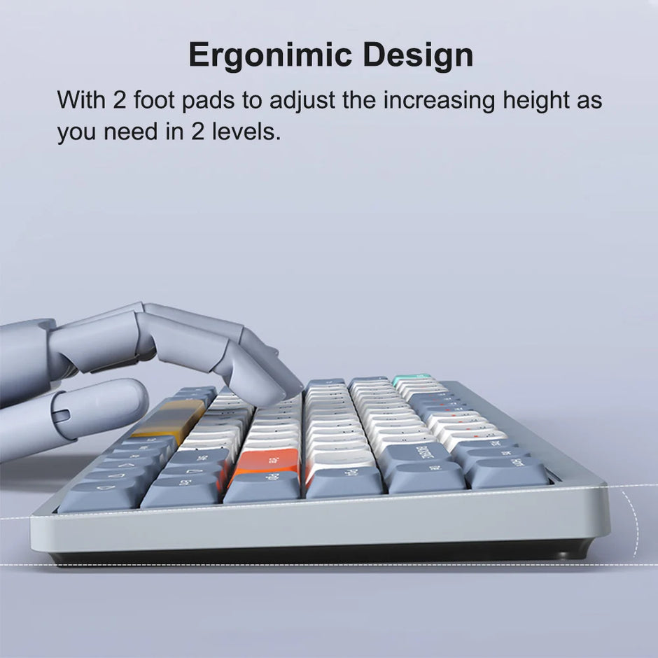 A robotic hand types on a HeadphoneHeat Wireless Mechanical Keyboard, showcasing its ergonomic design and Bluetooth wireless feature. The keyboard, with grey, white, and orange keys, includes adjustable foot pads for two-level height customization and utilizes OUTEMU switches for a responsive typing experience.