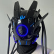 The HeadphoneHeat LED Lights Cyberpunk Full Face Masks feature angular designs, blue LED lighting with a front circular light ring, and electronic protrusions and tubing for a sci-fi robotic look.