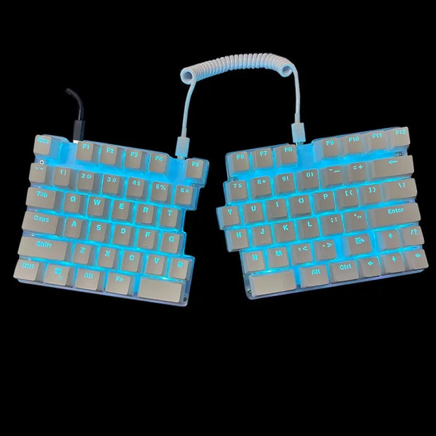 The DEBROGLIE LT78 Split Creative Mechanical Keyboard by HeadphoneHeat features ergonomic design, blue backlighting on a black background, coiled cable connection for each half, Kailh switches, function keys, and standard keys for an enhanced typing experience.