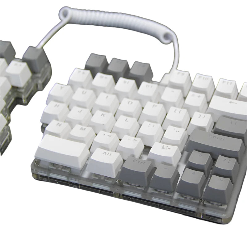 The DEBROGLIE LT78 Split Creative Mechanical Keyboard by HeadphoneHeat features an ergonomic design with a coiled cable linking the two sections. It showcases white and gray keys, and Kailh switches can be seen beneath the transparent base, revealing internal components.