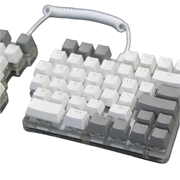 The DEBROGLIE LT78 Split Creative Mechanical Keyboard by HeadphoneHeat features an ergonomic design with a coiled cable linking the two sections. It showcases white and gray keys, and Kailh switches can be seen beneath the transparent base, revealing internal components.