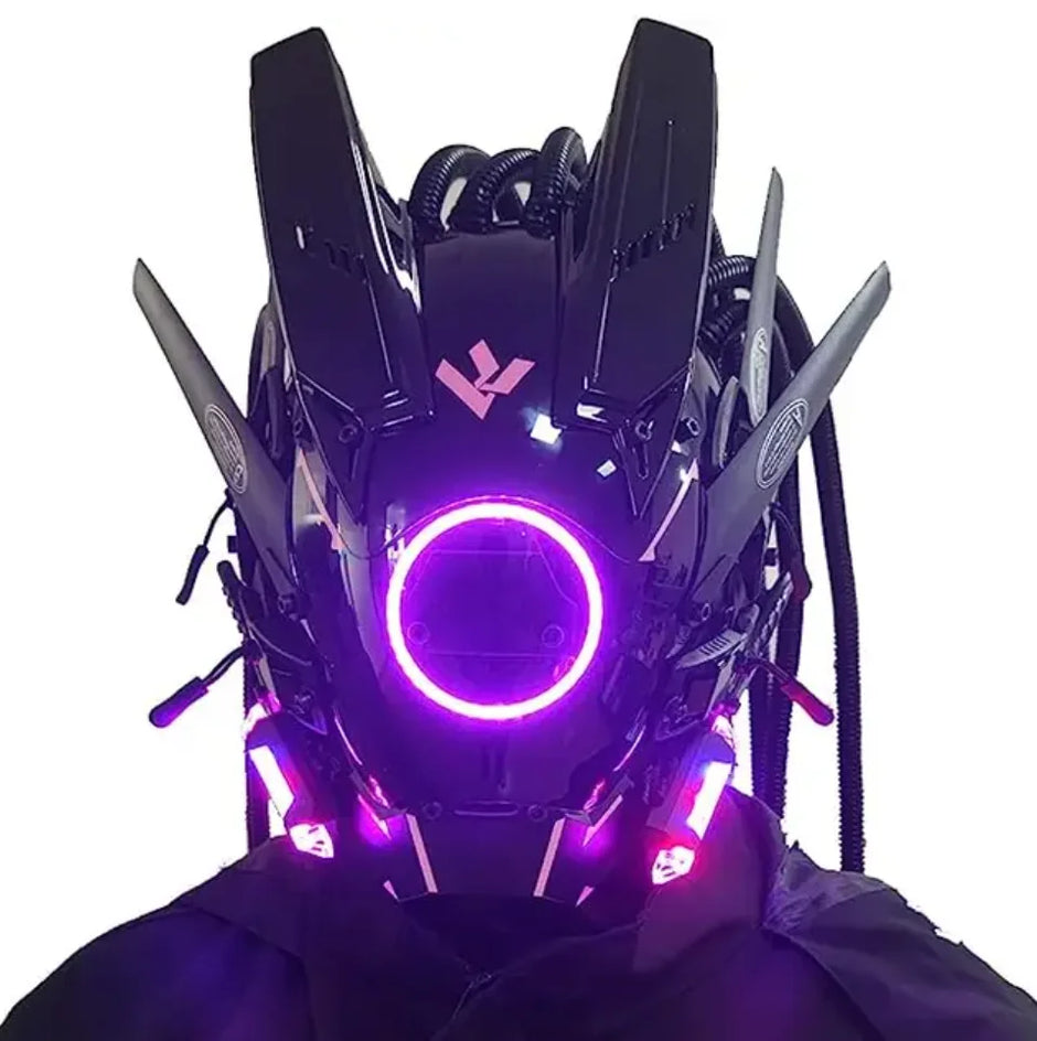The LED Lights Cyberpunk Full Face Masks by HeadphoneHeat features an angular, black design with glowing purple LEDs, antenna-like protrusions, tubes, and electronic elements, embodying a cyberpunk aesthetic perfect for dark settings.