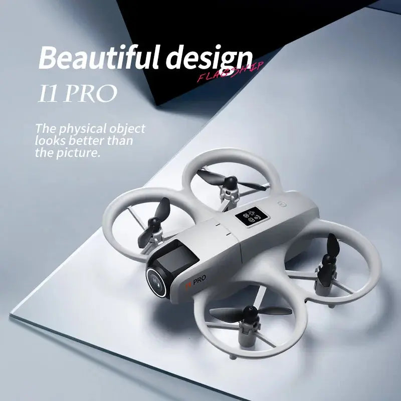 A sleek white DSer I1 PRO Drone 4K Professional HD Aerial Photography with four propellers rests on a reflective surface. Text: “Beautiful design, I1 PRO. Looks better in person—now with 4K HD video recording.”.
