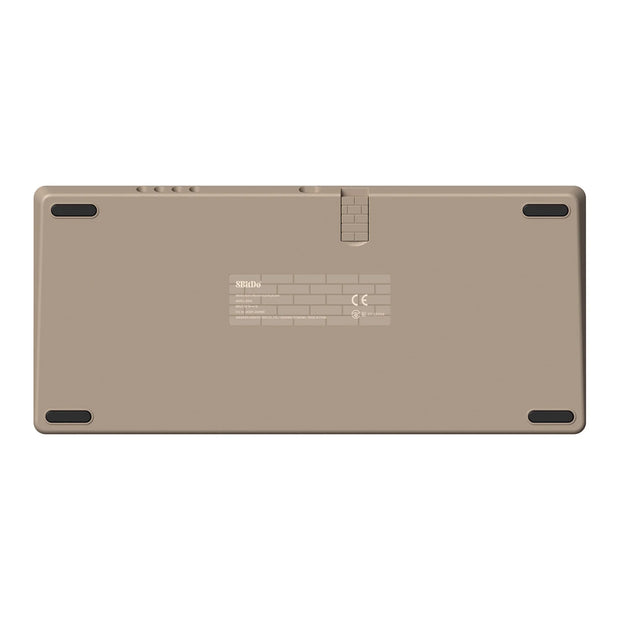 The image displays the back of a beige electronic device with rubber grips on the corners, reminiscent of an 8BitDo Retro Mechanical Keyboard design by HeadphoneHeat. It includes a label with text and symbols in the center and features a hinge-like detail at the top, enhancing its retro mechanical keyboard aesthetic.