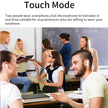 In a classroom, students engage with one another; some are using HeadphoneHeat's Intelligent Translate Earbuds, which support real-time translation across 144 languages. A woman with a tablet equipped with a voice translator app observes the conversation, while a man raises his hand to speak. The setting is completed by the presence of a chalkboard and bookshelf in the background.