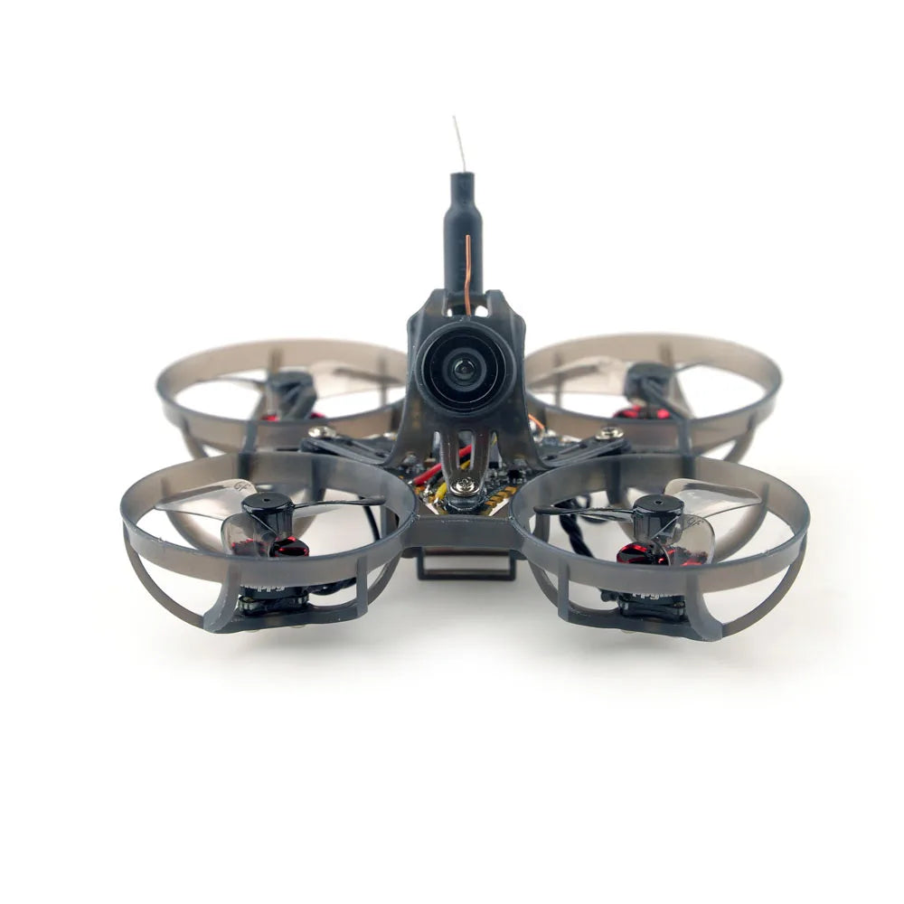 The HappyModel Mobula6 2024, a micro FPV drone from HeadphoneHeat, is an ultra-light 1S 65mm quadcopter featuring the SuperX Flight Controller and propeller guards, equipped with a front-facing camera and displayed on a white background.