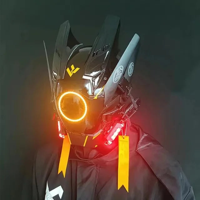HeadphoneHeat's LED Lights Cyberpunk Full Face Masks feature glowing orange and red LEDs, sleek black and silver panels, a front circular light, and elegant yellow side ribbons. Set against a dark backdrop, this mask showcases futuristic allure.