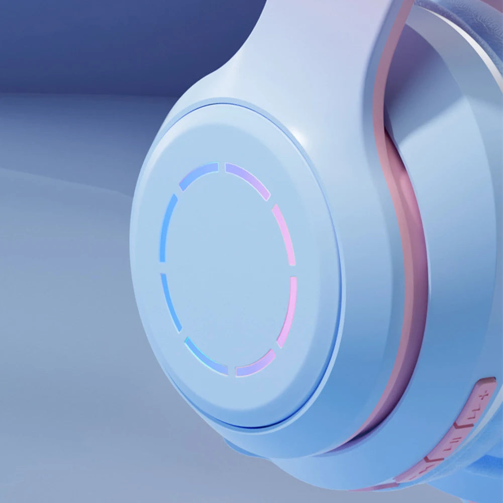 Close-up of the futuristic Wireless HiMISS HiFi Stereo Over Ear Headphones by HeadphoneHeat, featuring a sleek design in pastel blue and pink. The circular earcup glows subtly, with ergonomic ear hooks for comfort and volume control on the side amidst a smooth gradient of blue tones.