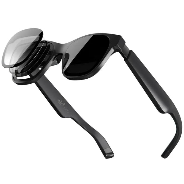 A pair of sleek black smart glasses featuring detachable, layered lenses against a white background highlights the flexible and adaptable design, echoing the cutting-edge aesthetics of the XReal Air 2 Pro AR Glasses by HeadphoneHeat in augmented reality.