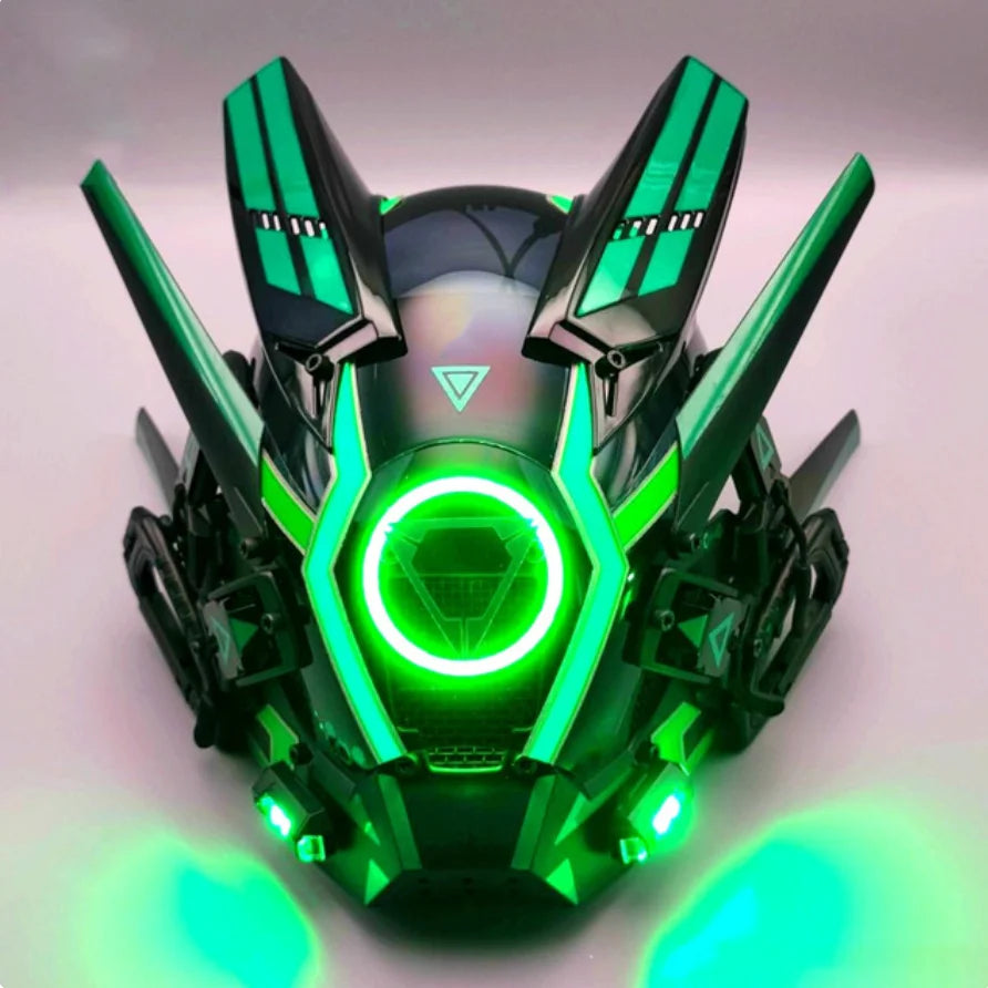 The LED Lights Cyberpunk Full Face Mask by HeadphoneHeat features an angular design with glowing green LEDs, geometric patterns, sharp wing-like accents, and a prominent central circular light, offering a high-tech sci-fi aesthetic.