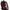 A person wears HeadphoneHeat's LED Lights Cyberpunk Full Face Mask, featuring glowing red LEDs and multiple black cables. The helmet's angular, sharp design enhances its cybernetic and high-tech look.