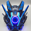 The HeadphoneHeat LED Lights Cyberpunk Full Face Mask is a futuristic black helmet with blue accents and angular protrusions. It resembles a high-tech, aggressive cyberpunk mask, featuring a central circular LED light and sleek geometric patterns for a sci-fi flair.