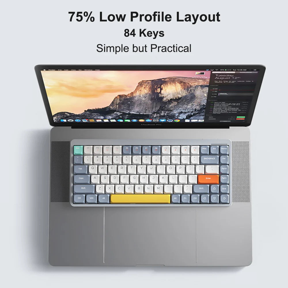 A laptop showcases the HeadphoneHeat Wireless Mechanical Keyboard, a Bluetooth wireless device with an 84-key low-profile layout and vibrant keycaps. The screen displays a scenic desktop wallpaper, complemented by text saying, 