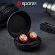A pair of Spares: High Fidelity Ear Plugs—reusable earplugs for clear sound—sit in an open case on a dark surface near a glove, multitool, and water bottle. 
