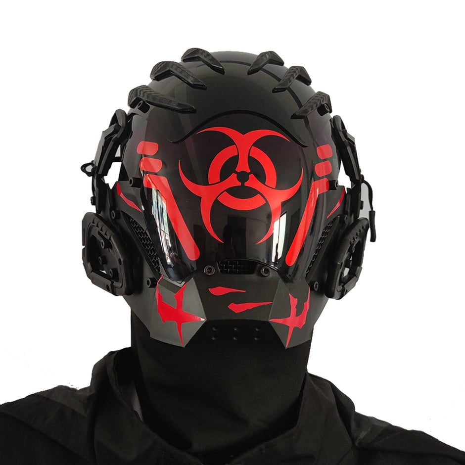 A person wears the Dropshipman Bioweapon Tech Mask, a full-face party helmet with angular red designs and a red biohazard symbol. This futuristic accessory features side attachments and is styled with sleek black clothing.