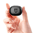 A hand holds a small, black Dropshipman Ultra-long Premium earbuds charging case with a digital display on the front, shown against a white background.