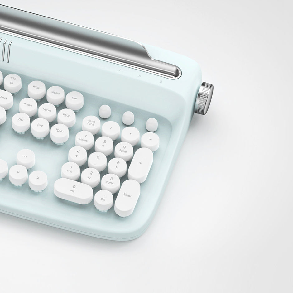 A close-up of the Dropshipman Tablet Phone Wireless Bluetooth Typewriter, featuring white rounded keys and a vintage typewriter design in light blue, set against a plain white background.